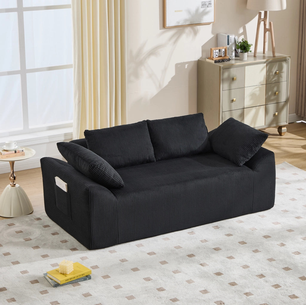 Divano senza struttura compatto in tessuto nero; 67 x 45 x 67 cm; con schienale alto e tasche laterali