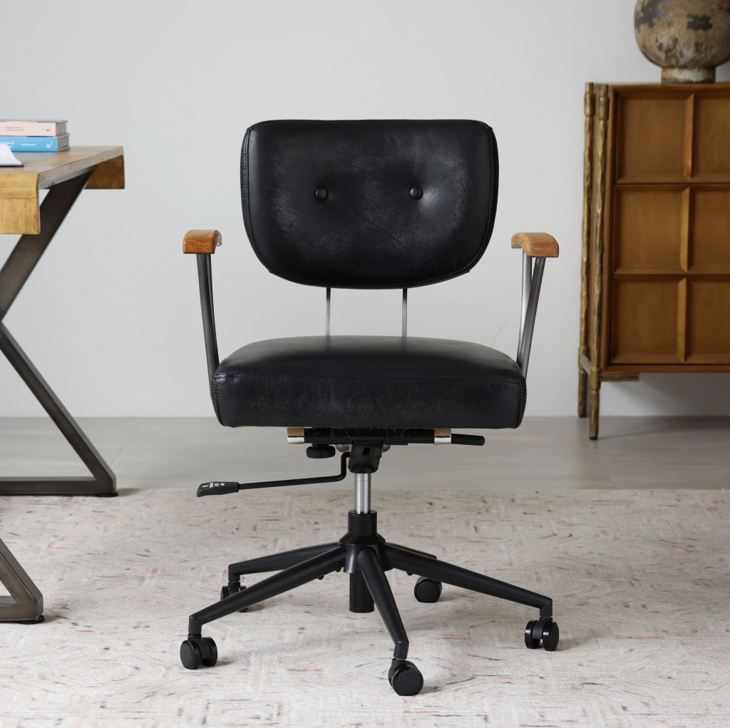 Sedia da ufficio in pelle nera girevole con ruote