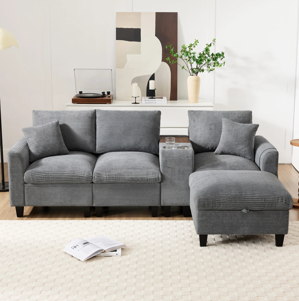 Divano angolare L 229x149.5x83 cm con console centrale; porta bicchieri e USB in velluto a coste grigio