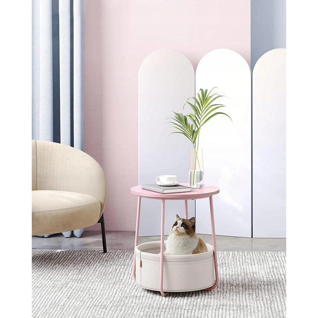 Tavolino rotondo moderno rosa pastello con cesto portaoggetti
