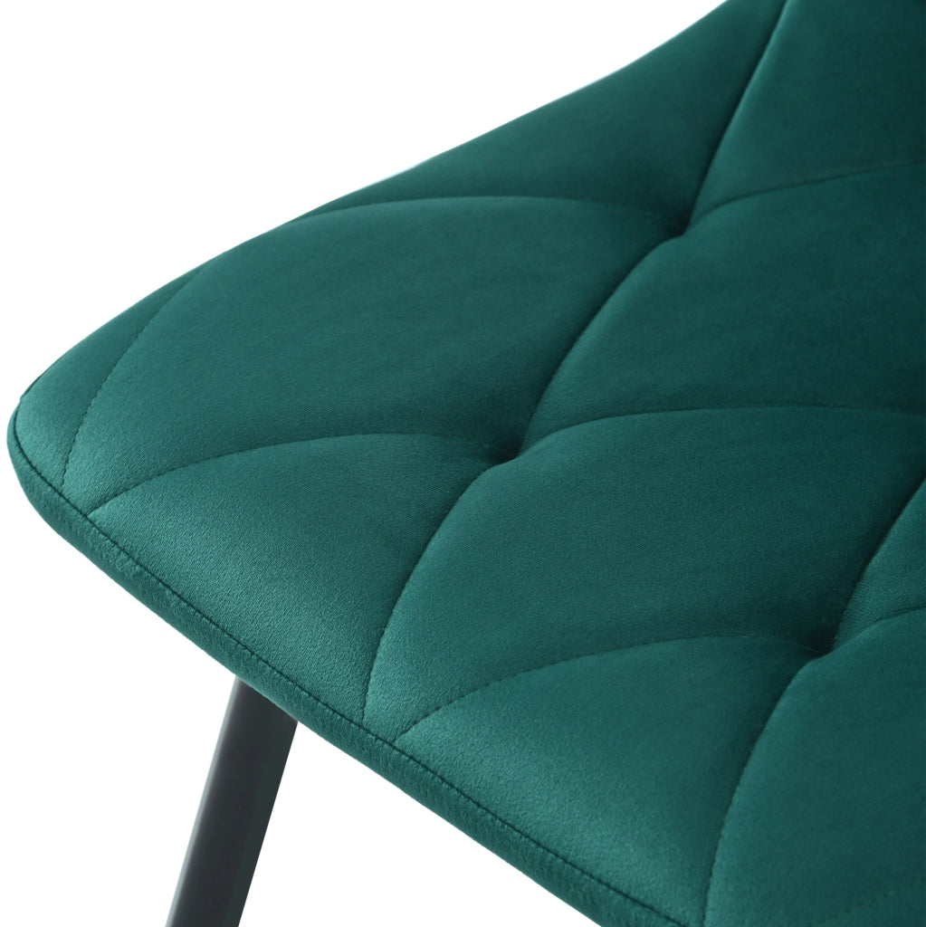 Set di 4 sedie da pranzo imbottite in velluto verde scuro; struttura in metallo