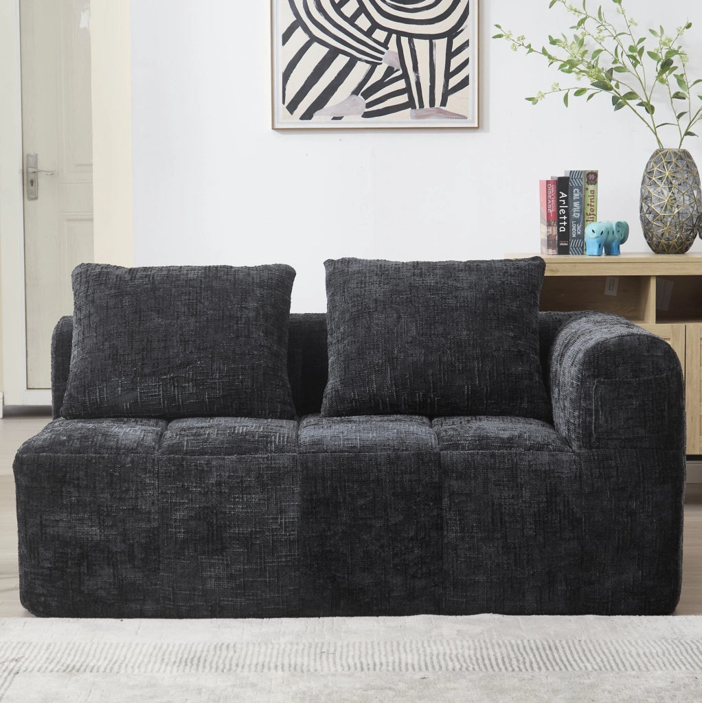 Divano a 2 posti nero con chaise longue, cuscino incluso e tasche laterali per telecomando e smartphone