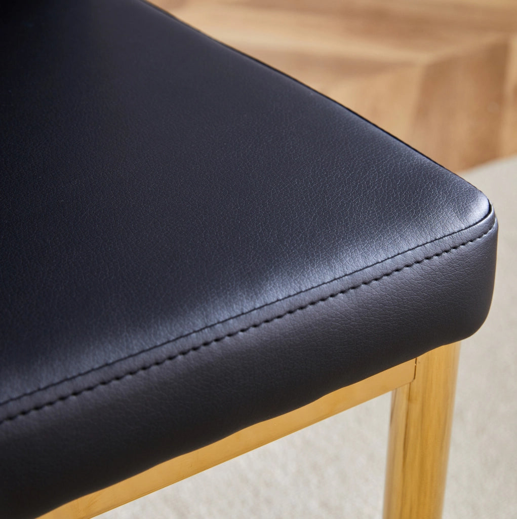 Set di 4 sedie da pranzo in PU nero con gambe dorate