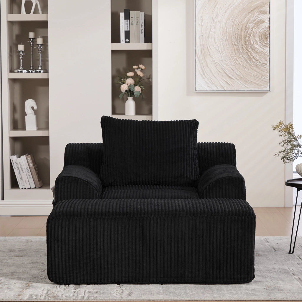 Poltrona Oversize con Poggiapiedi e Tasche Laterali; Seduta Profonda; Poltrona Imbottita in Velluto a Coste Nero