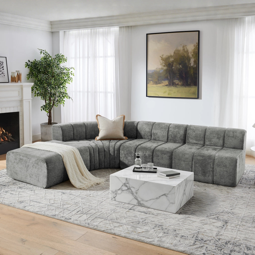 Divano angolare componibile modulare in chenille grigio con moduli versatili e seduta confortevole