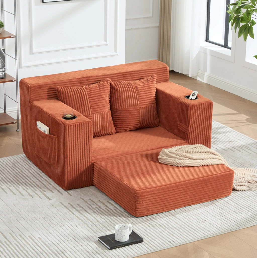 Divano pouf in velluto a coste arancione con tasche laterali e 2 cuscini; 151 x 133 x 64 cm
