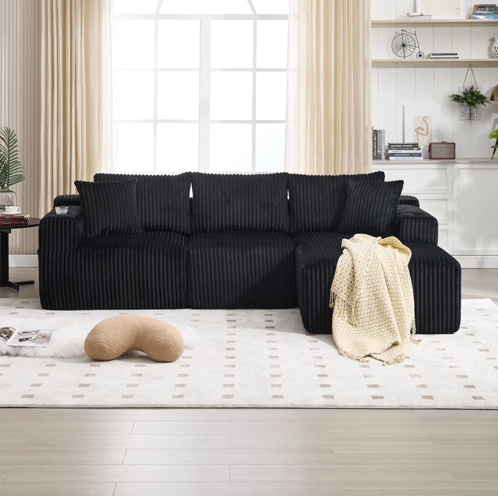 Divano modulare 257x160x62 cm con 5 cuscini; tasche laterali e portabicchieri in velluto a coste nero