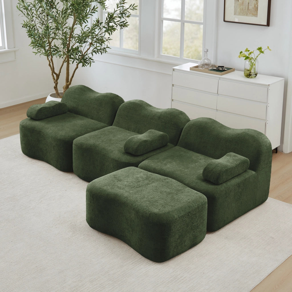 Divano angolare modulare 3 posti con pouf; seduta profonda e braccioli mobili in velluto verde