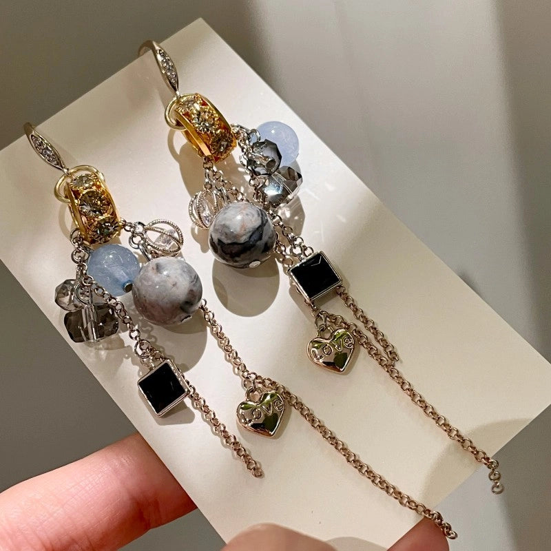 Orecchini vintage con sfera di cristallo blu e nappa