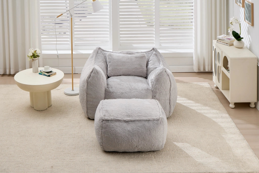 Poltrona sacco in pelliccia sintetica grigia, con schienale ergonomico e imbottitura in schiuma tritata