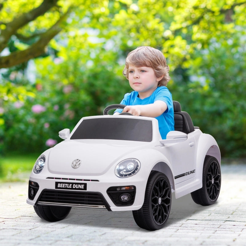 Macchina elettrica per bambini, modello Maggiolino VW, velocit¨¤ 3-5 km/h, con telecomando e musica, colore bianco.