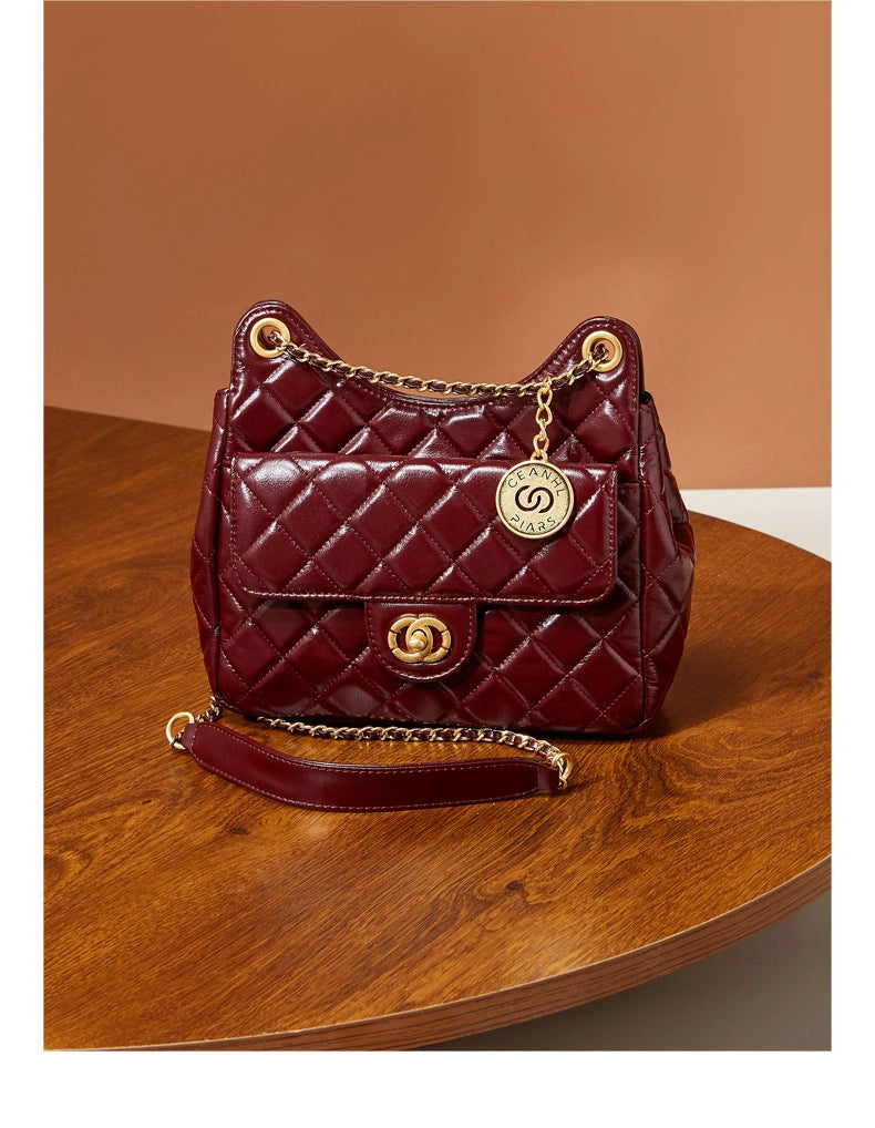 Borsa a tracolla da donna in vera pelle, colore viola.