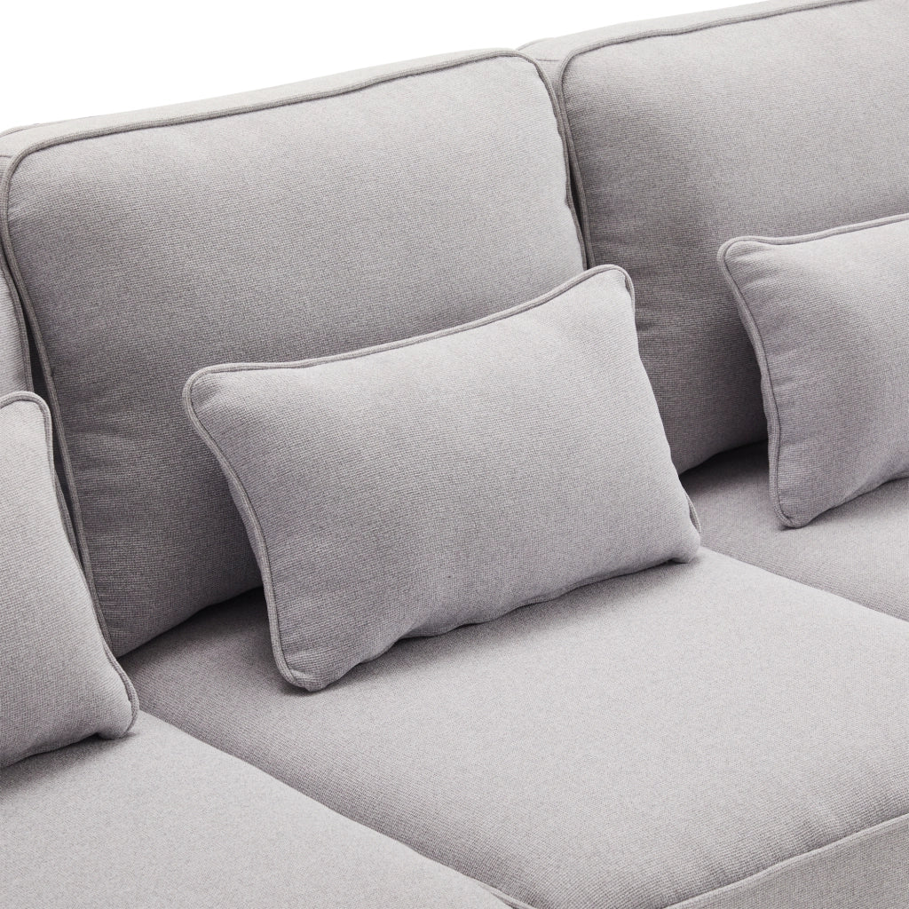 Divano 4 posti 264 cm con tasche sui braccioli e 4 cuscini in tessuto effetto lino grigio