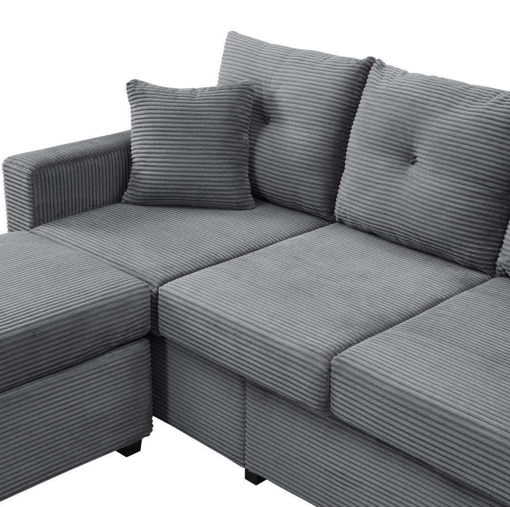 Divano modulare a L in velluto a coste con LED e pouf