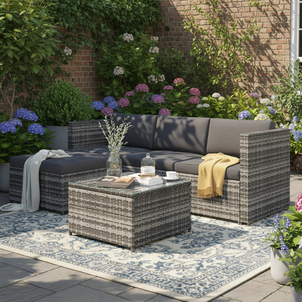Set divano angolare giardino ¨C Minimal ¨C polyrattan grigio con cuscini e tavolo con piano in vetro