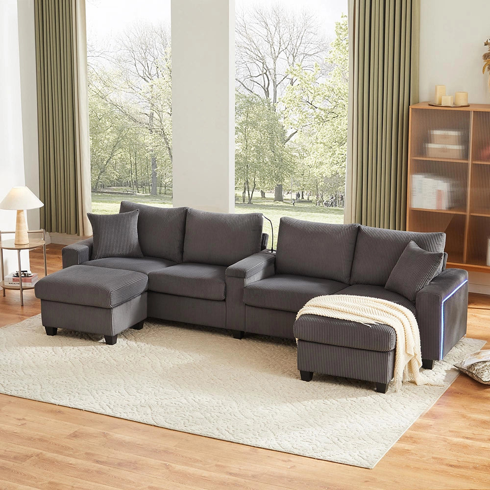 Divano a U in velluto costato - Xylo - 334x128,5x81cm - Grigio - 2 sgabelli, luce lettura, vassoio, porta-bevande, USB/Type-C, braccioli LED