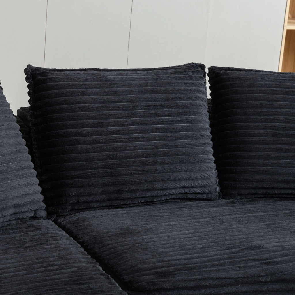 Divano ad arco in velluto a coste nero con portabevande e tasche laterali; 250×152×82 cm