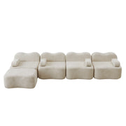 Divano angolare modulare senza struttura; seduta profonda; pouf collegabile; velluto beige
