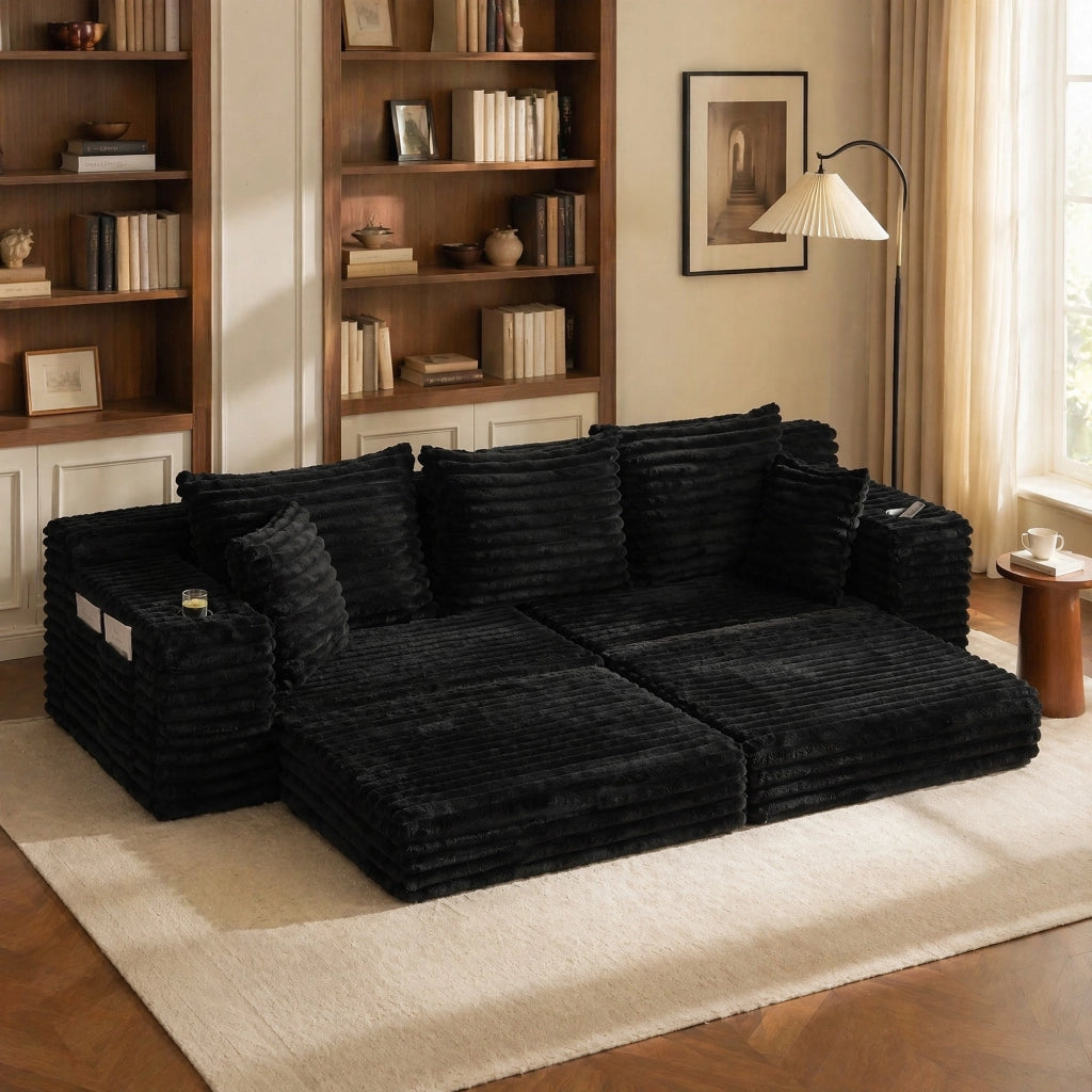 Divano in tessuto corduroy nero con schienale alto, tasche laterali, portabicchieri e funzione letto