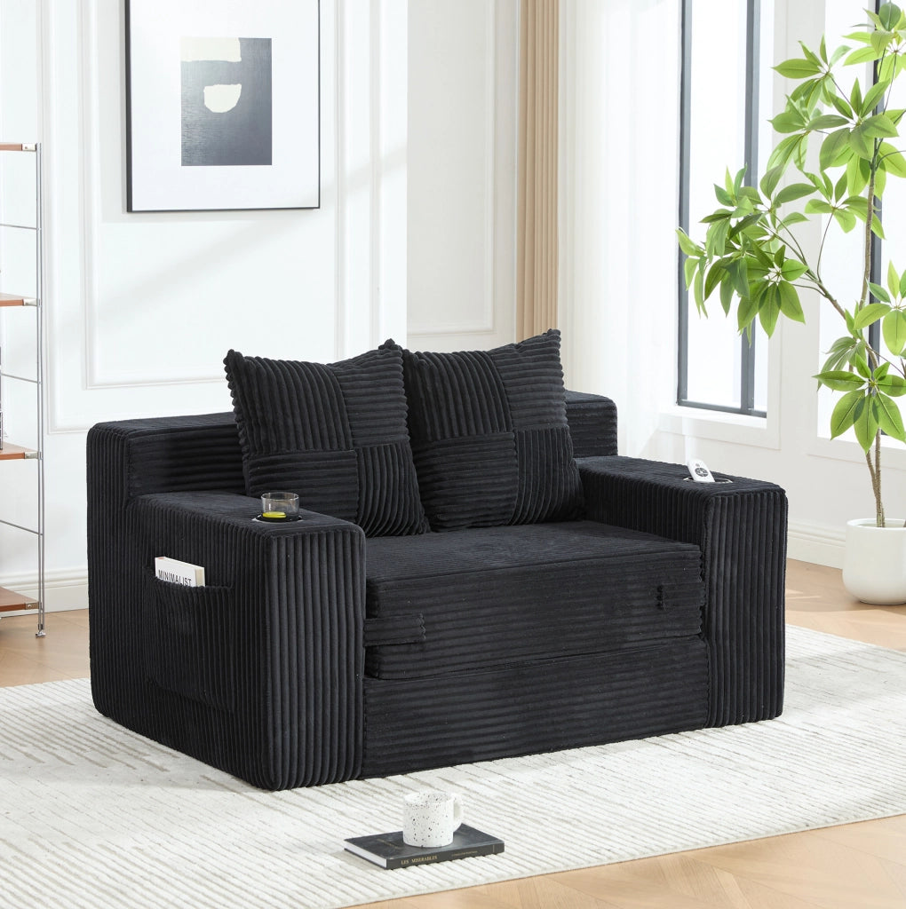 Divano pouf in velluto a coste nero 151x133 cm con tasche laterali e 2 cuscini HOMVRA