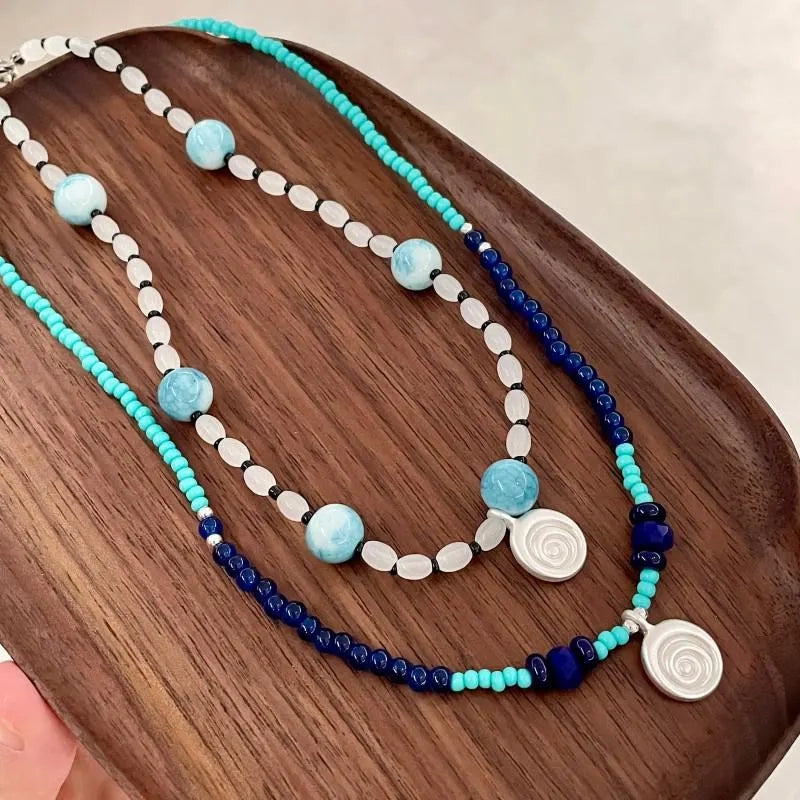 Collana con ciondolo a forma di conchiglia in pietra naturale: gioielli boho con perline