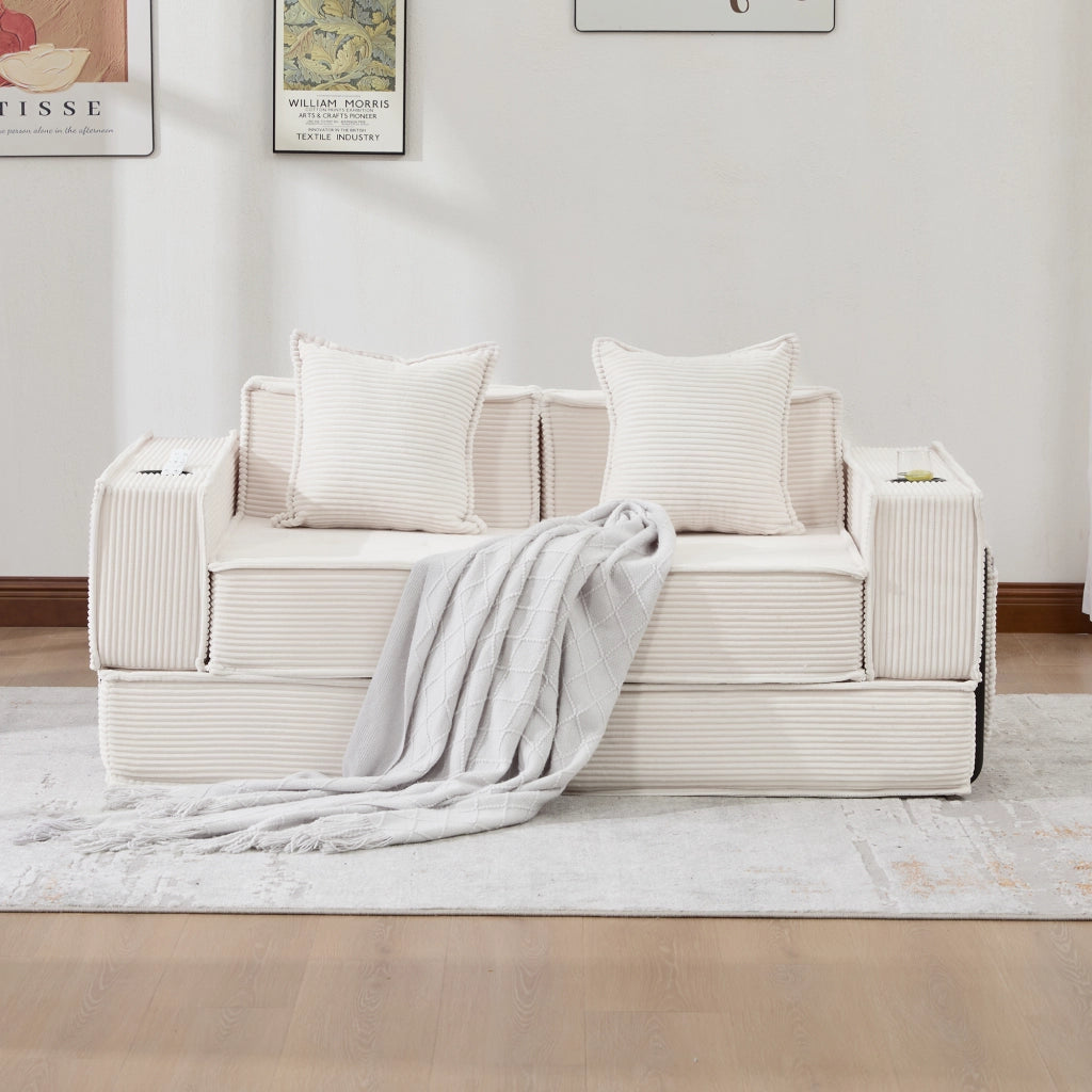 Divano modulare in corduroy beige con cuscini e tasche laterali per angoli lettura e relax