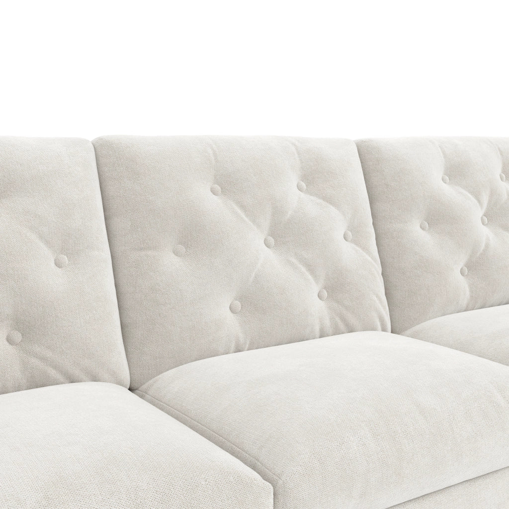 Divano letto angolare beige con contenitore, schienale trapuntato e vani laterali