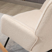 Poltrona a dondolo con schienale capitonné e rivestimento in tessuto bouclé; beige