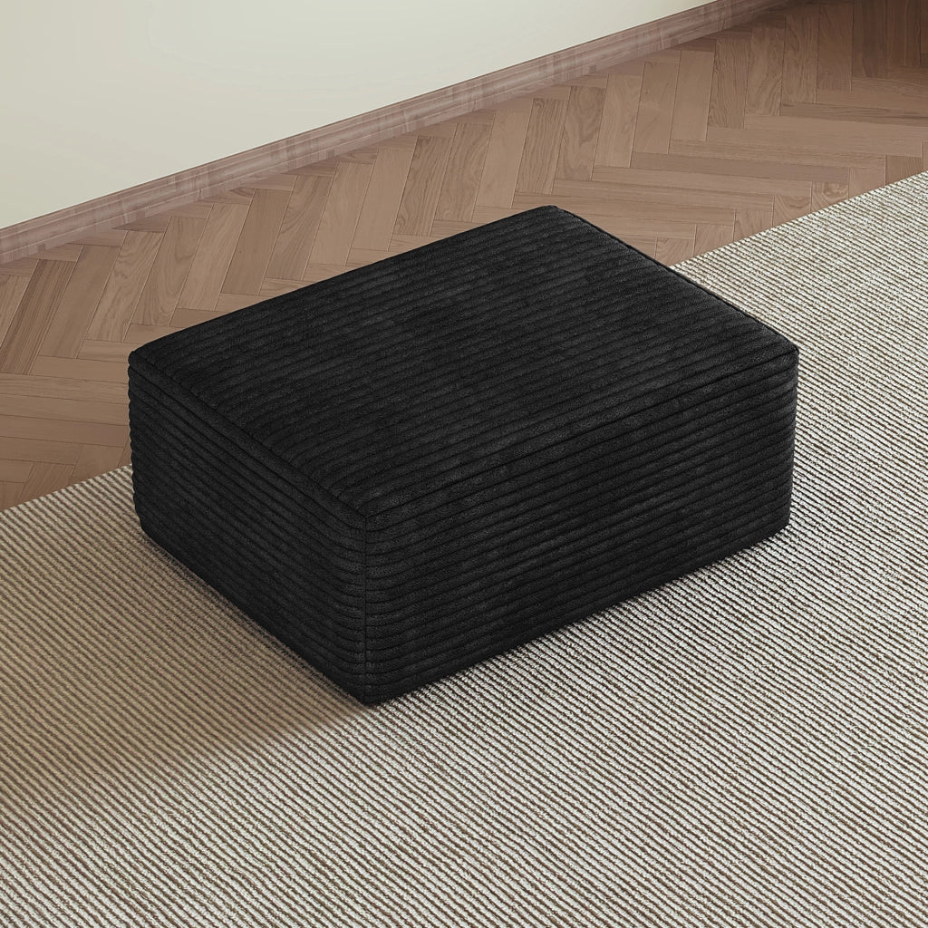 Pouf in tessuto effetto velluto a coste nero