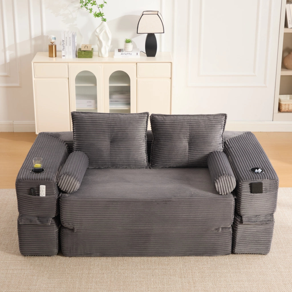 Divano letto modulare in tessuto a coste con tasche laterali, portabicchieri e cuscini memory grigio scuro