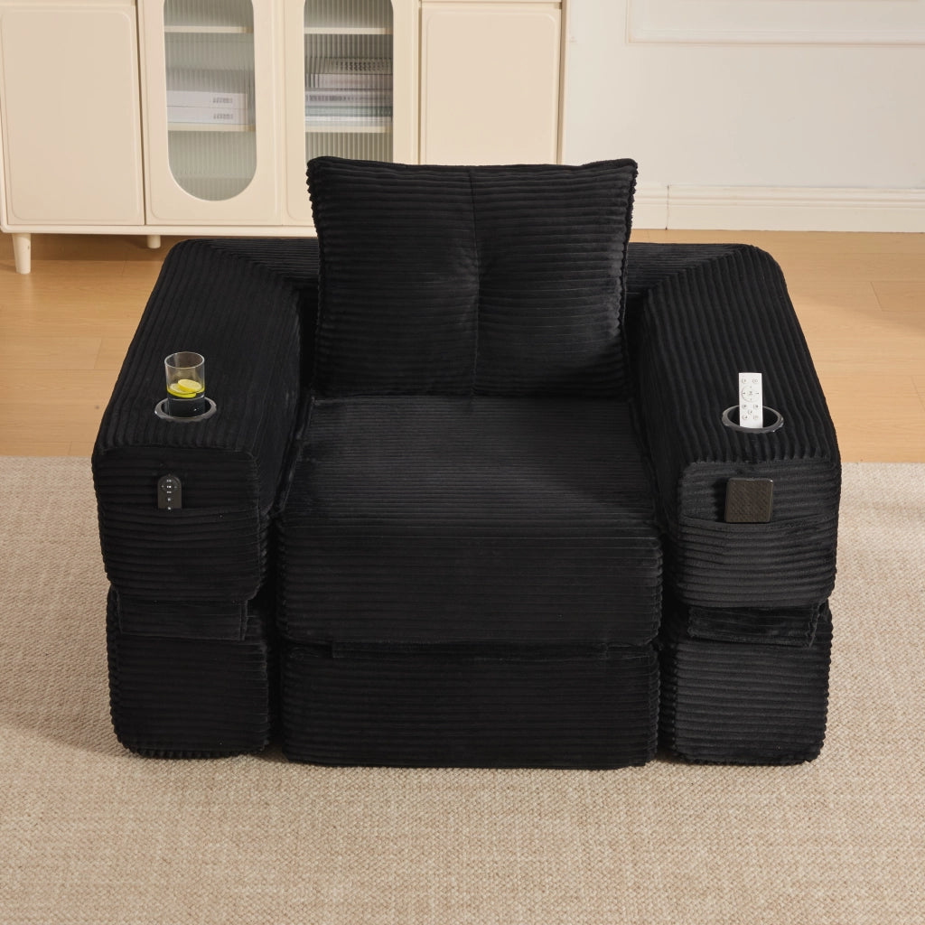 Divano convertibile in velluto a coste con molle, cuscini in memory foam, tasche laterali e portabicchieri nero