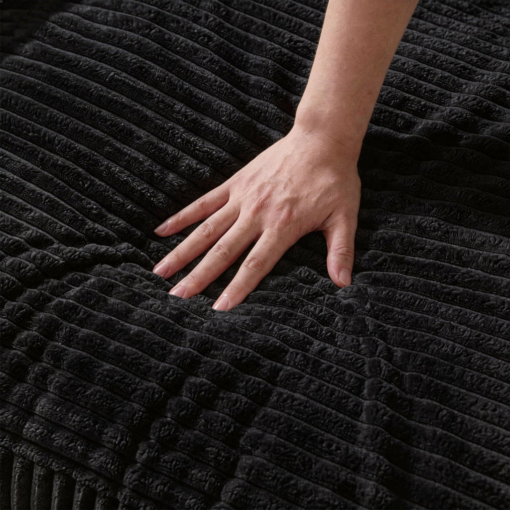 Divano angolare modulare reversibile con chaise longue e seduta profonda in velluto a coste nero