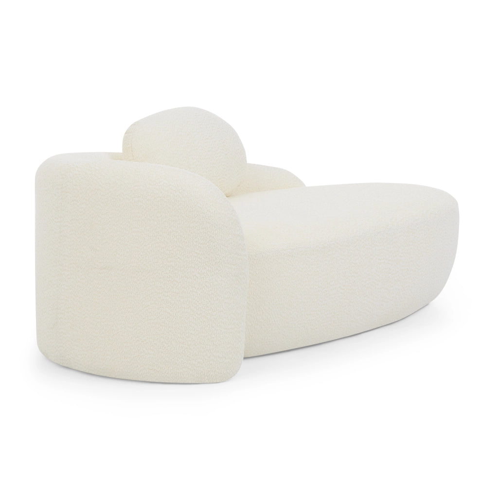 Sofa minimalista in tessuto Teddy beige con cuscino; design arrotondato