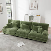 Divano modulare in chenille verde con seduta profonda e braccioli imbottiti arrotondati