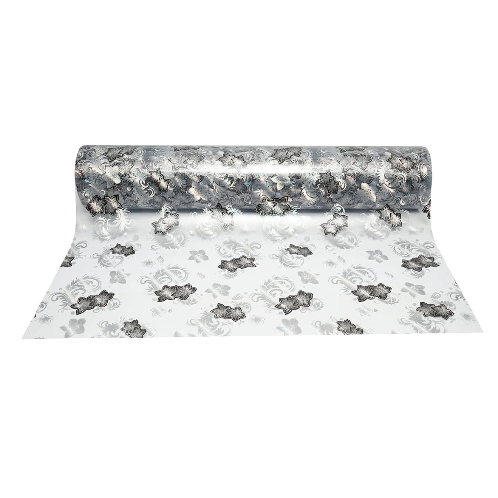 Rotolo pellicola protettiva per tavolo in PVC siliconato trasparente – modello floreale nero Materiale: PVC siliconato trasparente  Dimensioni rotolo: 1,00 × 20 m Breckner Germany