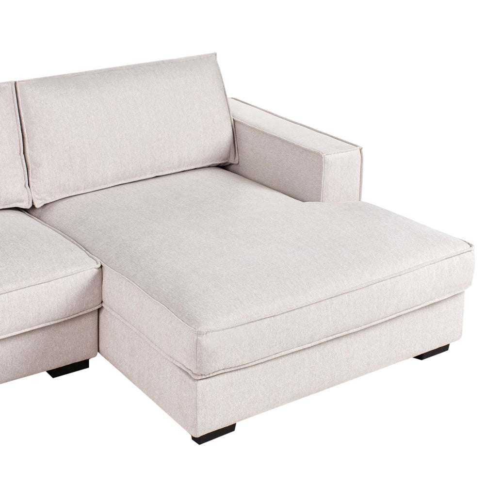 Divano 2 posti ad angolo con schienale in tessuto imbottito e cuscini beige chiaro lato sinistro stile moderno