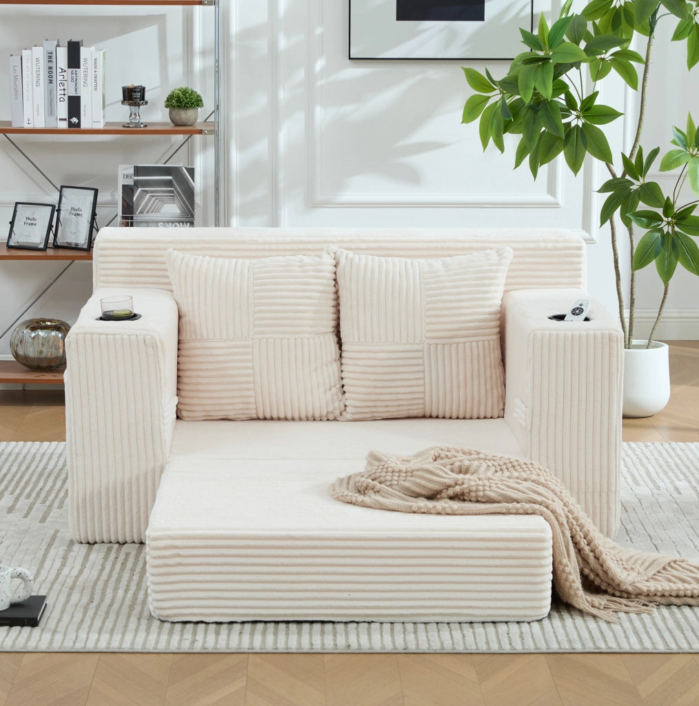 Pouf sofa in velluto a coste beige con 2 cuscini e tasche laterali; 151x133x64 cm