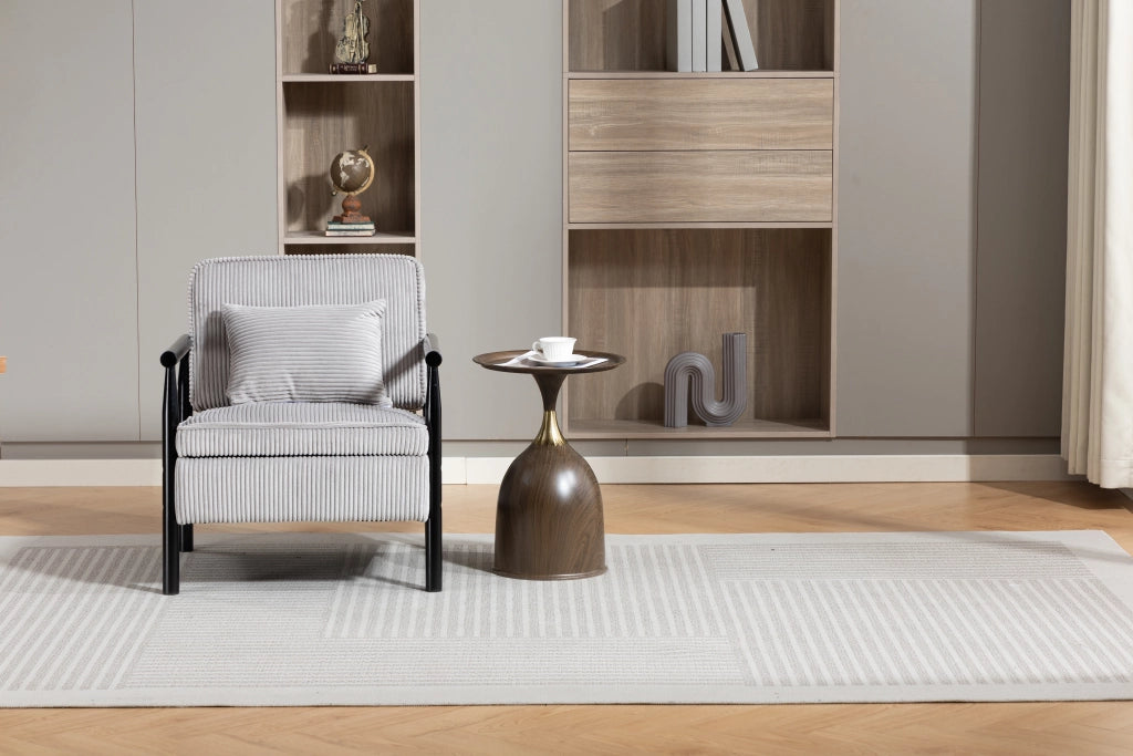Poltrona contenitore in velluto grigio chiaro con struttura in legno e cuscino lombare
