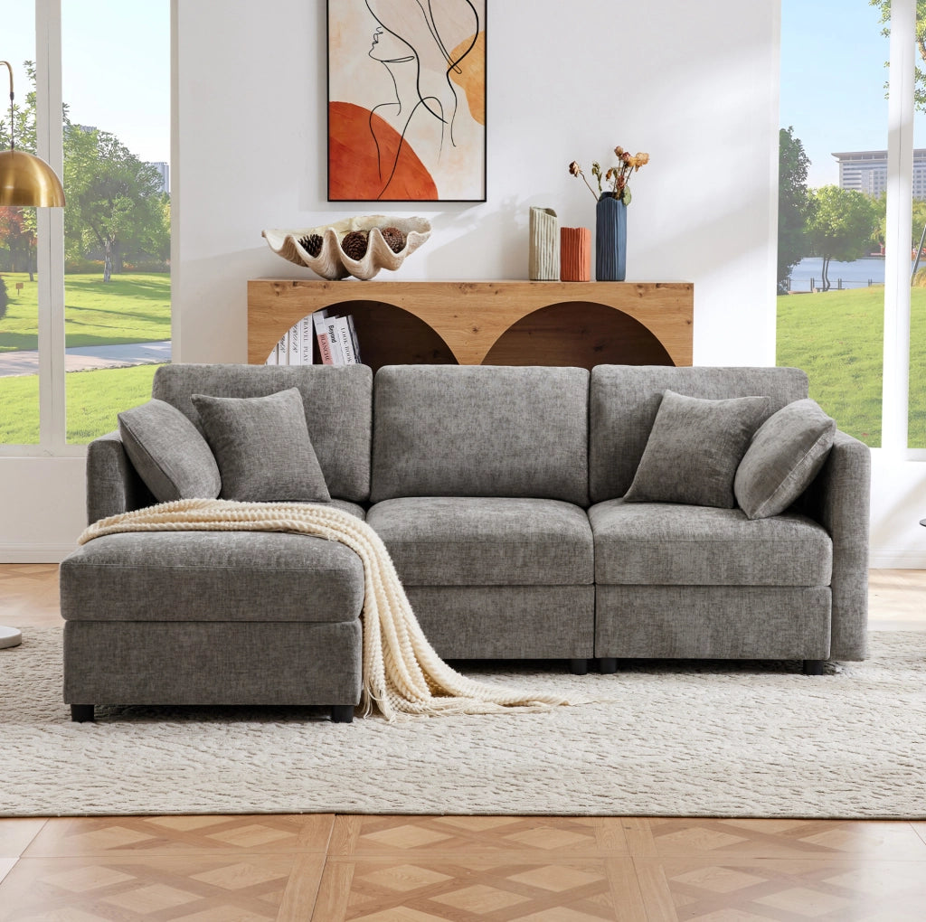 Divano angolare modulare a L con pouf; 3-4 posti; in tessuto Chenille grigio 218 x 156;5 x 86 cm