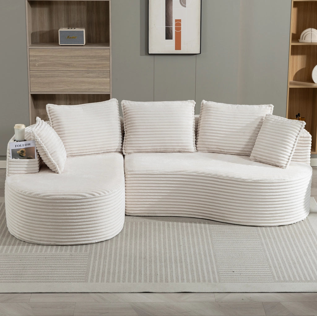 Divano curvo beige in velluto a coste con portabevande e tasche laterali per il massimo comfort