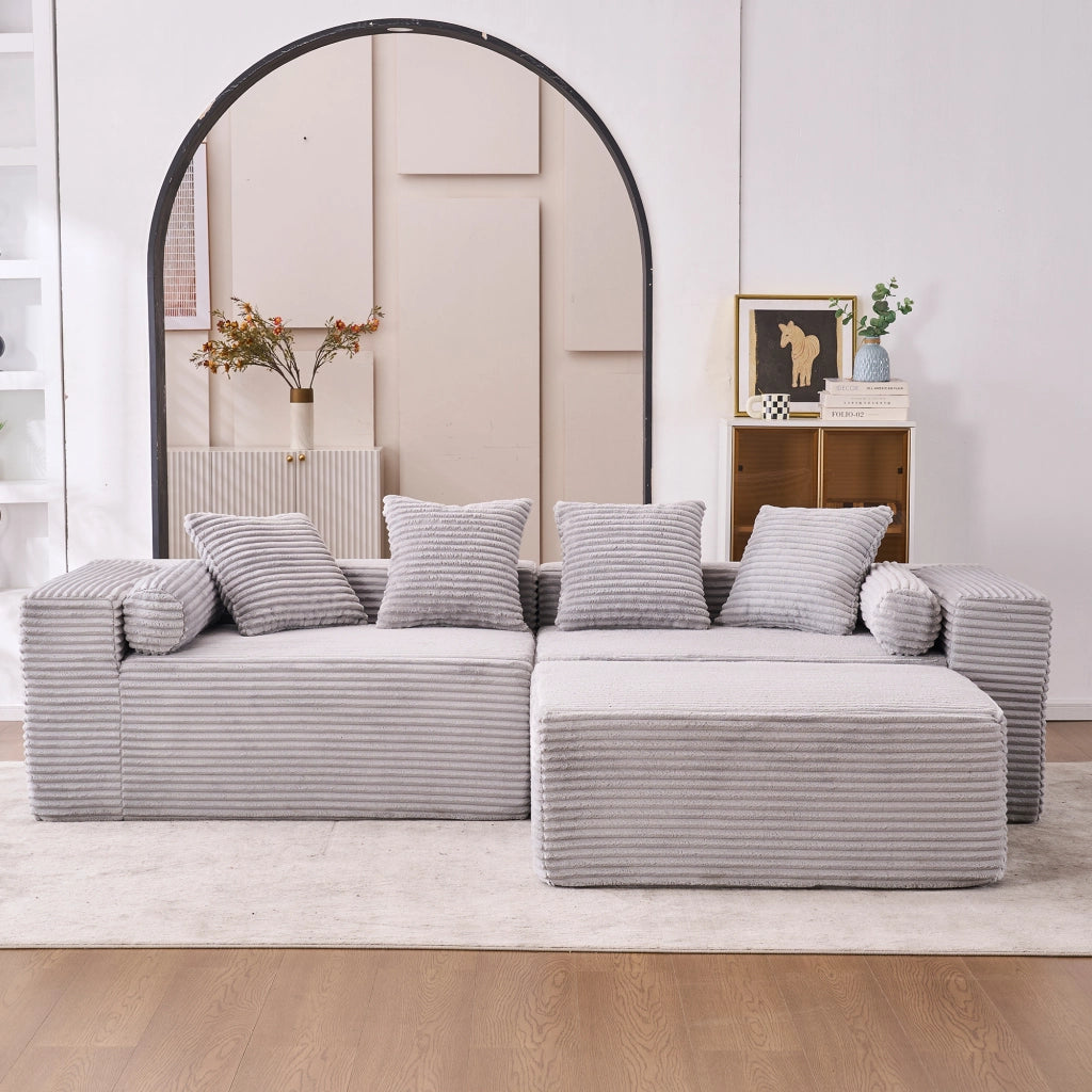 Divano angolare modulare senza attrezzi con chaise longue e seduta oversize per salotto in tessuto chenille grigio
