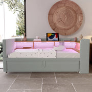 Divano letto estraibile 90/180x190 cm con LED; prese e vani portaoggetti; in flanella grigio chiaro