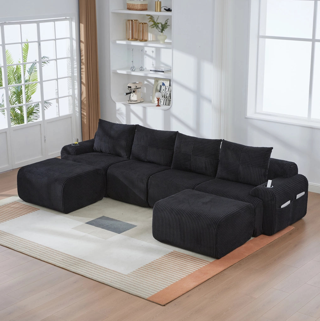 Divano modulare 4 posti in corduroy nero; con portabicchiere e tasca laterale; 333 x 174 x 80 cm