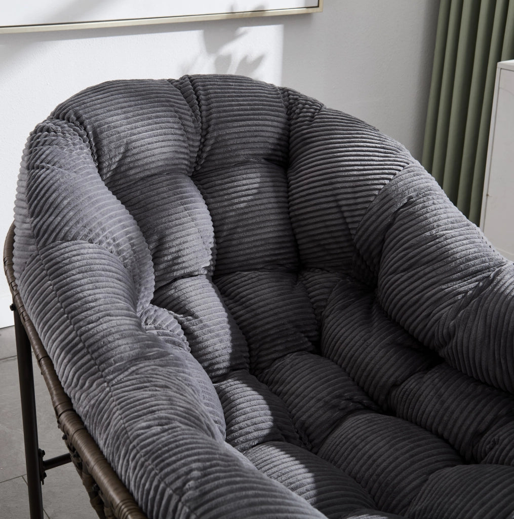 Sedia a dondolo da esterno in rattan sintetico grigio con cuscino