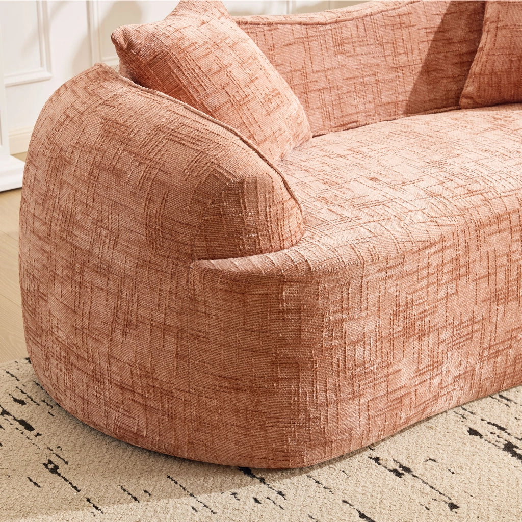 Divano curvo a due posti con supporto ergonomico e cuscini, in schiuma e molle rosa per soggiorno e camera da letto