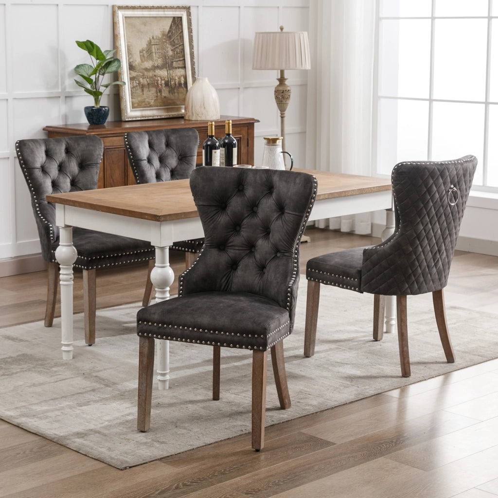Sedia da pranzo imbottita con gambe regolabili e borchie decorative e manico posteriore in velluto grigio