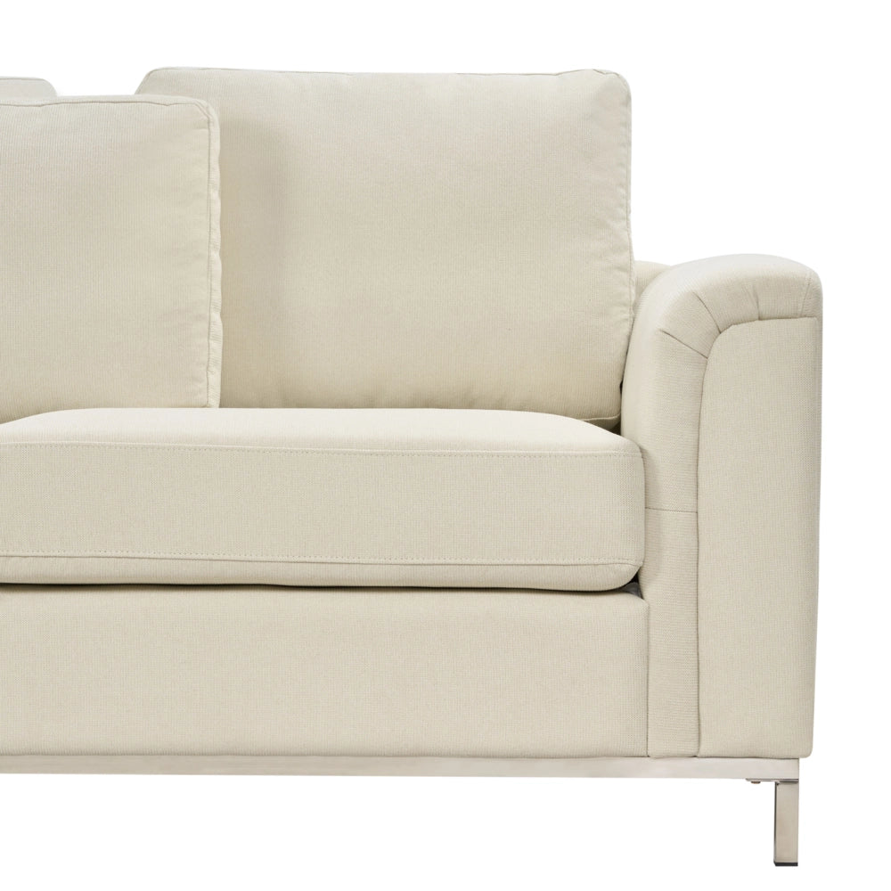 Divano ad angolo rivestito in tessuto beige con ottomana a forma di L con orientamento a versione destra