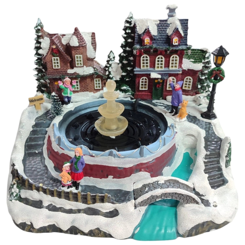 Villaggio Natalizio con Fontana Acqua Luci Musica Movimento 26cm LED Multicolor
