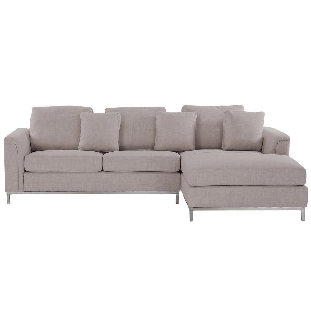 Divano ad angolo rivestito in tessuto beige a forma di L con orientamento a versione sinistra