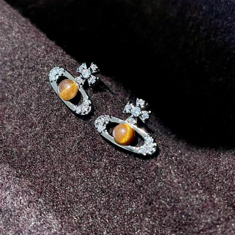 Orecchini a spillo in argento S925 dallo stile dolce e raffinato; orecchini a lobo con occhio di tigre in cristallo nero.
